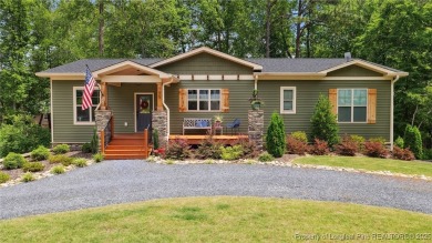 Welcome to this meticulously crafted 4-bedroom, 3-bathroom home on Country Club of North Carolina in North Carolina - for sale on GolfHomes.com, golf home, golf lot