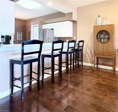 This light-filled 2-bedroom, 2-bath condominium offers the on Naples Heritage Golf and Country Club in Florida - for sale on GolfHomes.com, golf home, golf lot