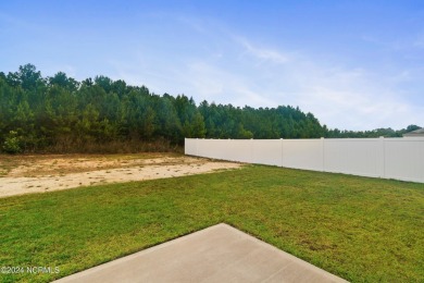 Discover this nearly new, charming single-level home with a low on Lennon Hills Golf Course in North Carolina - for sale on GolfHomes.com, golf home, golf lot