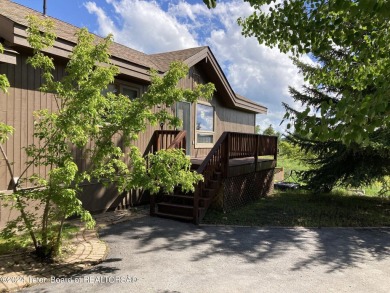 11 Last Chance Circle, a beautifully landscaped home in the on Cedar Creek Golf Course in Wyoming - for sale on GolfHomes.com, golf home, golf lot