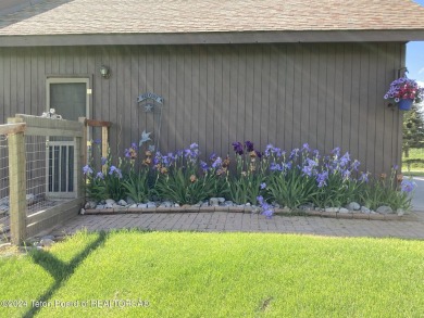 11 Last Chance Circle, a beautifully landscaped home in the on Cedar Creek Golf Course in Wyoming - for sale on GolfHomes.com, golf home, golf lot