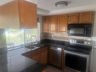 Welcome to this charming waterfront-view 2-bedroom, 2-bath on Beacon Woods Golf Club in Florida - for sale on GolfHomes.com, golf home, golf lot