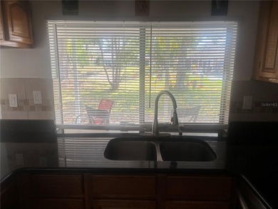 Welcome to this charming waterfront-view 2-bedroom, 2-bath on Beacon Woods Golf Club in Florida - for sale on GolfHomes.com, golf home, golf lot