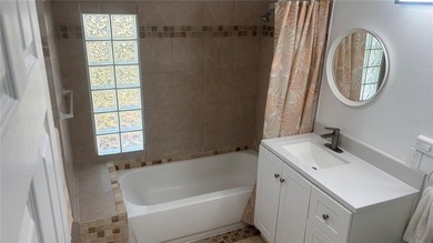 Welcome to this charming waterfront-view 2-bedroom, 2-bath on Beacon Woods Golf Club in Florida - for sale on GolfHomes.com, golf home, golf lot