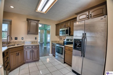 Nestled across from the fairway of the Heartland Golf Club, this on Pine Valley Golf Resort in Kentucky - for sale on GolfHomes.com, golf home, golf lot