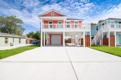 The home is elevated on pilings to allow for covered parking and on Rockport Country Club in Texas - for sale on GolfHomes.com, golf home, golf lot