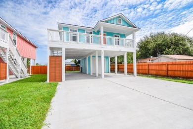 The home is elevated on pilings to allow for covered parking and on Rockport Country Club in Texas - for sale on GolfHomes.com, golf home, golf lot