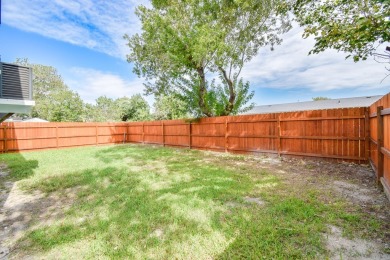 The home is elevated on pilings to allow for covered parking and on Rockport Country Club in Texas - for sale on GolfHomes.com, golf home, golf lot