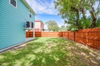 The home is elevated on pilings to allow for covered parking and on Rockport Country Club in Texas - for sale on GolfHomes.com, golf home, golf lot