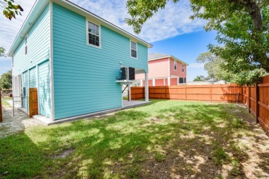 The home is elevated on pilings to allow for covered parking and on Rockport Country Club in Texas - for sale on GolfHomes.com, golf home, golf lot