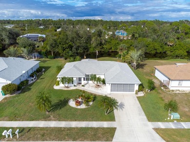 Situated in the desirable Gardens of Gulf Cove, this CANAL-FRONT on Duffys Golf Center in Florida - for sale on GolfHomes.com, golf home, golf lot