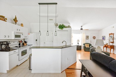 Situated in the desirable Gardens of Gulf Cove, this CANAL-FRONT on Duffys Golf Center in Florida - for sale on GolfHomes.com, golf home, golf lot