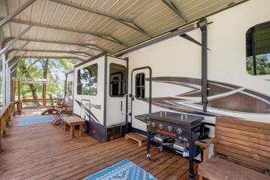 Sit back on your covered porch and soak in the breathtaking on Links At Lands End in Texas - for sale on GolfHomes.com, golf home, golf lot
