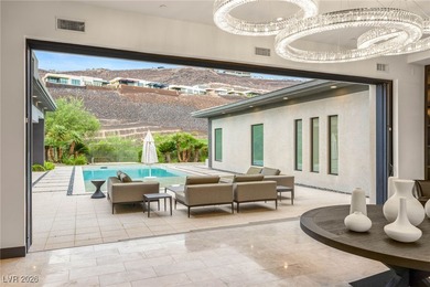 Tucked behind the gates of MacDonald Highlands, this exquisite on Dragon Ridge Country Club in Nevada - for sale on GolfHomes.com, golf home, golf lot
