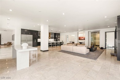 Tucked behind the gates of MacDonald Highlands, this exquisite on Dragon Ridge Country Club in Nevada - for sale on GolfHomes.com, golf home, golf lot