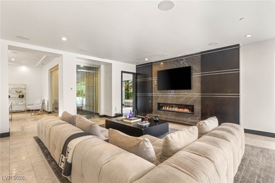 Tucked behind the gates of MacDonald Highlands, this exquisite on Dragon Ridge Country Club in Nevada - for sale on GolfHomes.com, golf home, golf lot