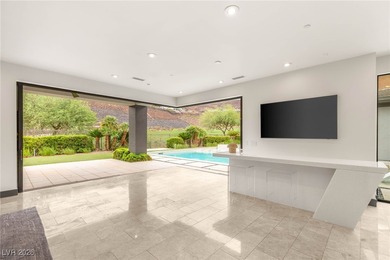 Tucked behind the gates of MacDonald Highlands, this exquisite on Dragon Ridge Country Club in Nevada - for sale on GolfHomes.com, golf home, golf lot