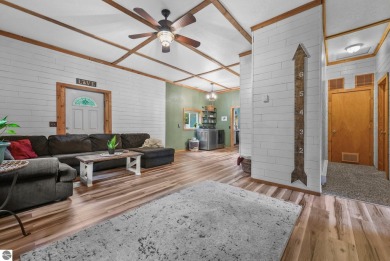 Nestled in an idyllic setting, this Barndominium home boasts on Lakes of the North Deer Run Golf Course in Michigan - for sale on GolfHomes.com, golf home, golf lot