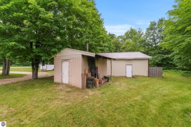 Nestled in an idyllic setting, this Barndominium home boasts on Lakes of the North Deer Run Golf Course in Michigan - for sale on GolfHomes.com, golf home, golf lot