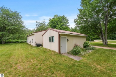 Nestled in an idyllic setting, this Barndominium home boasts on Lakes of the North Deer Run Golf Course in Michigan - for sale on GolfHomes.com, golf home, golf lot