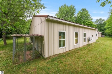 Nestled in an idyllic setting, this Barndominium home boasts on Lakes of the North Deer Run Golf Course in Michigan - for sale on GolfHomes.com, golf home, golf lot