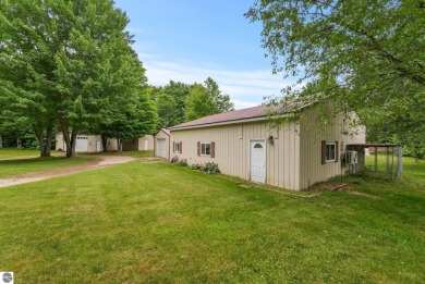 Nestled in an idyllic setting, this Barndominium home boasts on Lakes of the North Deer Run Golf Course in Michigan - for sale on GolfHomes.com, golf home, golf lot