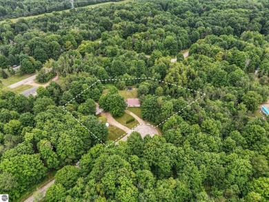 Nestled in an idyllic setting, this Barndominium home boasts on Lakes of the North Deer Run Golf Course in Michigan - for sale on GolfHomes.com, golf home, golf lot