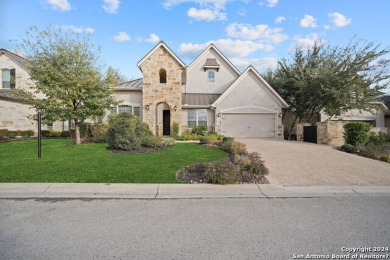 This stunning single-story home in The Dominion boasts four on The Dominion Country Club in Texas - for sale on GolfHomes.com, golf home, golf lot