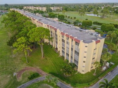 This beautifully renovated ground-floor corner unit offers on Poinciana Golf Club in Florida - for sale on GolfHomes.com, golf home, golf lot