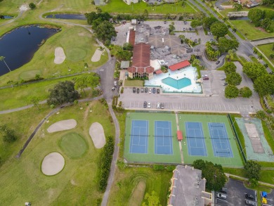 This beautifully renovated ground-floor corner unit offers on Poinciana Golf Club in Florida - for sale on GolfHomes.com, golf home, golf lot