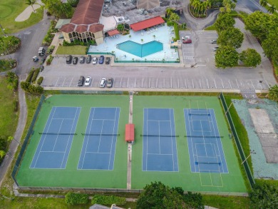 This beautifully renovated ground-floor corner unit offers on Poinciana Golf Club in Florida - for sale on GolfHomes.com, golf home, golf lot