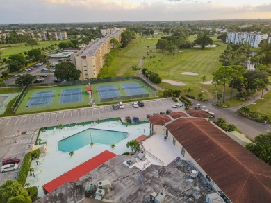 This beautifully renovated ground-floor corner unit offers on Poinciana Golf Club in Florida - for sale on GolfHomes.com, golf home, golf lot