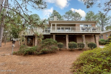 Nestled among the serene longleaf pines, this charming brick on Talamore Golf Club in North Carolina - for sale on GolfHomes.com, golf home, golf lot