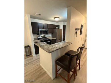 REMODELED, GUARD GATED, SECOND FLOOR CONDO WITH GORGEOUS STACKED on Canyon Gate Country Club in Nevada - for sale on GolfHomes.com, golf home, golf lot