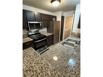 REMODELED, GUARD GATED, SECOND FLOOR CONDO WITH GORGEOUS STACKED on Canyon Gate Country Club in Nevada - for sale on GolfHomes.com, golf home, golf lot