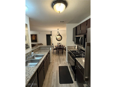REMODELED, GUARD GATED, SECOND FLOOR CONDO WITH GORGEOUS STACKED on Canyon Gate Country Club in Nevada - for sale on GolfHomes.com, golf home, golf lot