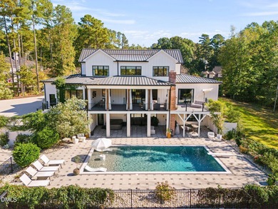 Welcome to homestead living at its finest that offers 5 bedrooms on Hasentree Club in North Carolina - for sale on GolfHomes.com, golf home, golf lot