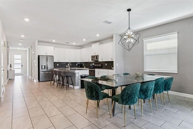 Step into the ultimate Florida lifestyle with this stunning on The Oasis Club at Champions Gate in Florida - for sale on GolfHomes.com, golf home, golf lot