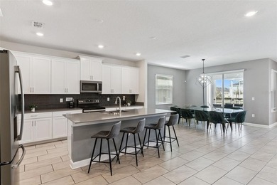 Step into the ultimate Florida lifestyle with this stunning on The Oasis Club at Champions Gate in Florida - for sale on GolfHomes.com, golf home, golf lot