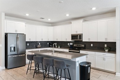 Step into the ultimate Florida lifestyle with this stunning on The Oasis Club at Champions Gate in Florida - for sale on GolfHomes.com, golf home, golf lot