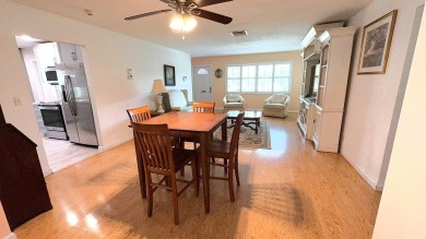 This charming 2-bedroom, 2-bathroom home in Palm Beach on Leisureville Community Golf Course in Florida - for sale on GolfHomes.com, golf home, golf lot