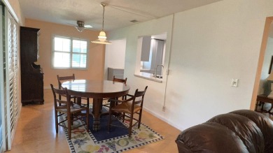This charming 2-bedroom, 2-bathroom home in Palm Beach on Leisureville Community Golf Course in Florida - for sale on GolfHomes.com, golf home, golf lot
