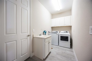 Executive 4-bedroom, 2-bath pool home with a 2-car garage and on Sarasota National Golf Club in Florida - for sale on GolfHomes.com, golf home, golf lot