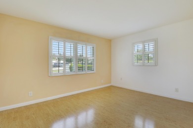This charming 2-bedroom, 2-bathroom home in Palm Beach on Leisureville Community Golf Course in Florida - for sale on GolfHomes.com, golf home, golf lot
