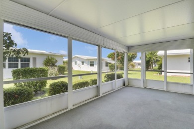 This charming 2-bedroom, 2-bathroom home in Palm Beach on Leisureville Community Golf Course in Florida - for sale on GolfHomes.com, golf home, golf lot