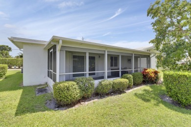 This charming 2-bedroom, 2-bathroom home in Palm Beach on Leisureville Community Golf Course in Florida - for sale on GolfHomes.com, golf home, golf lot