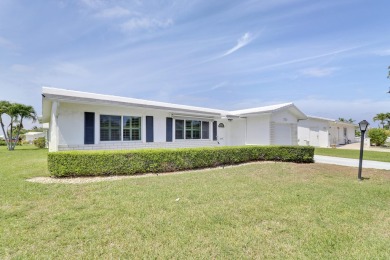 This charming 2-bedroom, 2-bathroom home in Palm Beach on Leisureville Community Golf Course in Florida - for sale on GolfHomes.com, golf home, golf lot