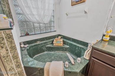 Welcome to 45 St Andrews Ct where elegance meets comfort in one on Grand Haven Golf Club in Florida - for sale on GolfHomes.com, golf home, golf lot