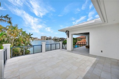 Experience unparalleled luxury in this exceptional bay front on The Moorings Country Club in Florida - for sale on GolfHomes.com, golf home, golf lot