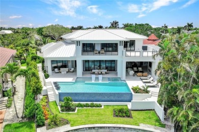 Experience unparalleled luxury in this exceptional bay front on The Moorings Country Club in Florida - for sale on GolfHomes.com, golf home, golf lot